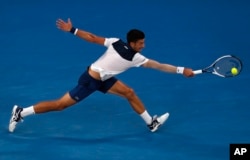 Serbia's Novak Djokovic reaches for a backhand return to South Korea's Chung Hyeon