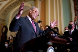 Senate Majority Leader Chuck Schumer, D-N.Y., speaks to reporters at the Capitol in Washington, Sept. 28, 2021.