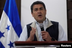 Honduras President and National Party candidate Juan Orlando Hernandez gestures as he addresses the media in Tegucigalpa, Honduras, Dec. 4, 2017.