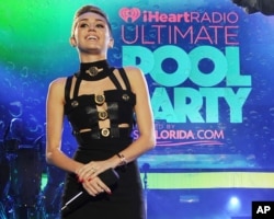 Miley Cyrus hosts the iHeartRadio Ultimate Pool Party at the Fontainebleau Hotel, June 29, 2013 in Miami.