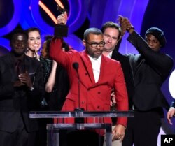 FILE - Jordan Peele accepts the award for best feature for "Get Out" at the 33rd Film Independent Spirit Awards in Santa Monica, Calif., March 3, 2018.