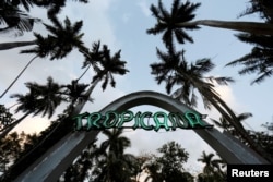 A neon sign shines over the entrance to the cabaret Tropicana in Havana, Cuba, Feb. 20, 2018.