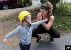 Lizabeth Loud, 32, plays with her son Eaghan, 2, at their home in Randolph, Mass., May 7, 2018.