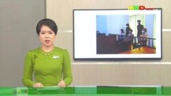 In this image from Myawaddy TV, a photograph of deposed Myanmar leader Aung San Suu Kyi's court appearance was shown during a report about her case is read by a news presenter Monday, May 24, 2021, in Naypyitaw, Myanmar. (Myawaddy TV via AP)