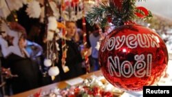 Christmas tree decorations are sold at the Christkindelsmaerik near Strasbourg Cathedral, Nov. 2012.