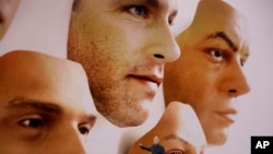 Phil Schiller, Apple's senior vice president of worldwide marketing, announces features of the new iPhone X at the Steve Jobs Theater on the new Apple campus on Tuesday, Sept. 12, 2017, in Cupertino, Calif. (AP Photo/Marcio Jose Sanchez)