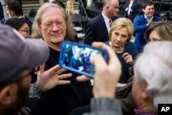 Democratic presidential candidate Hillary Clinton takes a question from a member of the audience after speaking at a rally at the University of Northern Iowa in Cedar Falls, Iowa, Jan. 26, 2016.