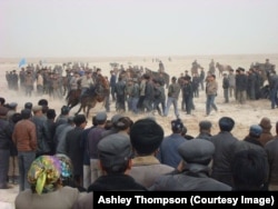 Ethnic Uyghurs compete in horse racing at a Nowruz event outside the city of Kuqa, in China's Xinjiang Uyghur Autonomous Region, March 21, 2011.