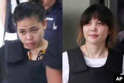 FILE - Indonesian Siti Aisyah, left, and Vietnamese Doan Thi Huong, right, are escorted by police as they leave their court hearing at Shah Alam court house in Shah Alam, outside Kuala Lumpur, Malaysia, Oct. 2, 2017.