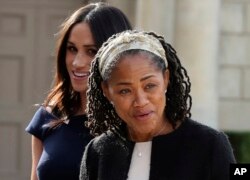 Meghan Markle, background, and her mother, Doria Ragland, arrive at Cliveden House Hotel, in Berkshire, England, May 18, 2018 to spend the night before her wedding to Prince Harry on May 19.