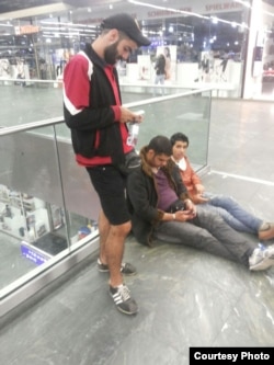In the Vienna train station, after days and nights of non-stop travel, the guys finally feel safe. Sept. 2015. (VOA/Courtesy)