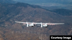 The world’s largest airplane, called Stratolaunch, flies during its first test flight above the Mojave Desert in California on Saturday, April 13, 2019. (Photo: Scaled Composites)