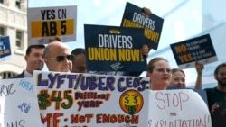In this Wednesday, Aug. 28, 2019, file photo, dozens of supporters of a measure to limit when companies can label workers as independent contractors rally at the Capitol in Sacramento, Calif. (AP Photo/Rich Pedroncelli, File)
