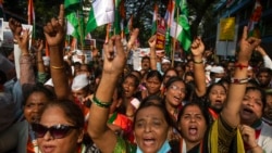 FILE - Supporters of India's main opposition Congress shout slogans during in a nationwide agitation against unemployment, inflation and price hike of essential commodities in Mumbai, Nov. 14, 2021.