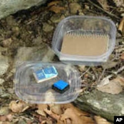 A typical letterbox contains a stamp, stamp pad and record book, which are left at the letterbox site.