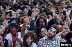 Zombies are also commonly seen at Halloween. Here, people dress as zombies during a Halloween event to promote the show "The Walking Dead" in Tokyo October 2013.