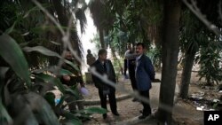 Indian investigators visit a spot which police say is where a Danish tourist was gang-raped in New Delhi, India, Jan. 15, 2014.