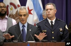 FILE - Chicago Mayor Rahm Emanuel, left, and Police Superintendent Garry McCarthy appear at a news conference in Chicago, Nov. 24, 2015.