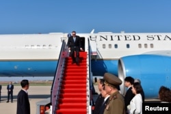 U.S. Secretary of State Mike Pompeo exits his plane on arrival in Pyongyang, North Korea, May 9, 2018.