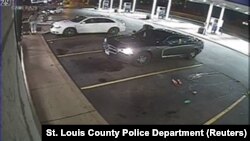 Surveillance video shows an officer-involved shooting during a routine business check at a gas station in Berkeley, Missouri, Dec. 23, 2014.