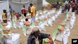 Men deliver aid donations from donors, in Aslam, Hajjah, Yemen, Sept. 23, 2018.