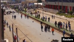 FILE - Anti-government demonstrators block a road in Bamenda, Cameroon, Dec. 8, 2016. 