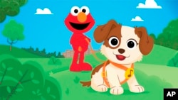 In this image provided by Sesame Workshop, Elmo and his new dog Tango are seen in an upcoming special show "Furry Friends Forever: Elmo Gets a Puppy," which will air on HBO Max on August 5. (Sesame Workshop vía AP) 