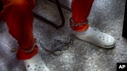 Guatemalan Hugo Alvaro Gomez sits as a judge reads his sentence during a courtroom hearing, in Guatemala City, Feb. 21, 2014.