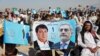 Supporters of Afghan presidential candidate Abdullah Abdullah attend a campaign rally in the Paghman district of Kabul, Afghanistan, June 9, 2014.