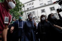 Rappler CEO and Executive Editor Maria Ressa, center, is escorted after attending her hearing in Manila, Philippines on June 15, 2020.