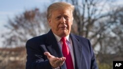 FILE - President Donald Trump speaks on the South Lawn of the White House as he walks from Marine One, Sunday, Jan. 6, 2019, in Washington. 