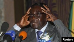 Zimbabwe's President Robert Mugabe speaks at the start of a conference of parties and civic society groups reviewing a draft constitution that, if adopted, will lead to Zimbabwe's next election, at a hotel in Harare, October 22, 2012.