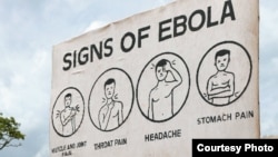 Sign displaying the symptoms of Ebola. AGI says leaders of Guinea, Liberia and Sierra Leone made critical decisions in effort to end Ebola. (Credit: AGI)