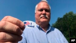 Voter Sandy Blackwell, speaks to a reporter after voting in Mint Hill, N.C. on Sept. 10, 2019.