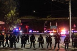 Portland police confront May Day protesters at the ICE facility on May 1, 2021 in Portland, Ore.