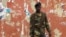 A soldier stands guard in a street near the National Assembly on April 13, 2012 in Bissau.