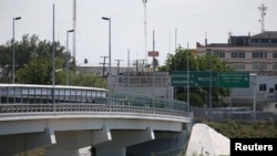 FILE - The Roma-Ciudad Miguel Aleman International Bridge, which spans the Rio Grande and Mexico-U.S. border, is seen from Roma, Texas, April 11, 2018. 