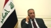 FILE - Iraqi Prime Minister Mustafa al-Kadhimi is pictured at his office in Baghdad, Iraq, May 9, 2020, in this government handout photo.