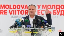 Socialist Party presidential candidate Igor Dodon speaks to the media after voting ended in the presidential elections, in Chisinau, Moldova, Nov. 13, 2016. Dodon, who campaigned on promises to restore closer ties with Russia, was running against pro-Europe candidate Maia Sandu.