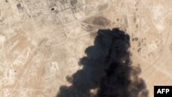 This satellite overview handout image obtained Sept. 16, 2019, courtesy of Planet Labs Inc. shows damage to an oil infrastructure from weekend drone attacks at Abqaig on Sept. 14, 2019, in Saudi Arabia.