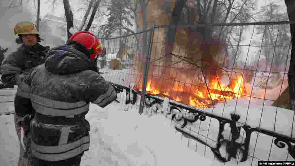 Riot police remove a tent camp set up last October by supporters of Mikheil Saakashvili, who are demanding President Petro Poroshenko resign, detaining over 100 people, in Kyiv, Ukraine, March 3, 2018.