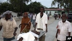 Wounded civilian at Madina hospital with injuries from roadside blast, Mogadishu, Somalia, Nov, 22, 2011.