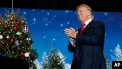 President-elect Donald Trump arrives to speak during a rally at the Orlando Amphitheater at the Central Florida Fairgrounds in Orlando, Florida, Dec. 16, 2016.