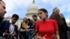 FILE - Rep.-elect Alexandria Ocasio-Cortez, D-N.Y., talks with reporters, Nov. 14, 2018, following a photo opportunity on Capitol Hill in Washington, with the freshman class.