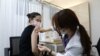 South Korean Olympic table tennis player Jeon Ji-Hee receives the first dose of the Pfizer-BioNTech coronavirus vaccine at the National Medical Center in Seoul, South Korea, April 29, 2021.