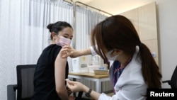 South Korean Olympic table tennis player Jeon Ji-Hee receives the first dose of the Pfizer-BioNTech coronavirus vaccine at the National Medical Center in Seoul, South Korea, April 29, 2021.