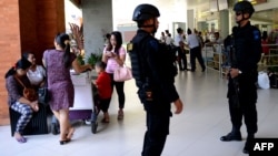 FILE - Indonesian Special Police patrol at Ngurah Rai Airport in Denpasar on Bali, Jan. 15, 2016, one day after a series of explosions hit the Indonesian capital, Jakarta. Islamic State suicide bombers and gunmen executed a Westerner in Jakarta and blew up a Starbucks.