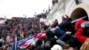 FILE - Pro-Trump protesters storm into the U.S. Capitol during a rally to contest the certification of the 2020 U.S. presidential election results by the U.S. Congress, in Washington, Jan. 6, 2021.