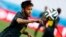 Brazil's Neymar eyes the ball during his team's final practice in Sao Paulo one day before the opening match of the soccer World Cup between Brazil and Croatia, June 11, 2014. 