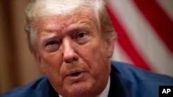 President Donald Trump speaks during a roundtable discussion with African-American supporters in the Cabinet Room of the White House, Wednesday, June 10, 2020, in Washington. (AP Photo/Patrick Semansky)